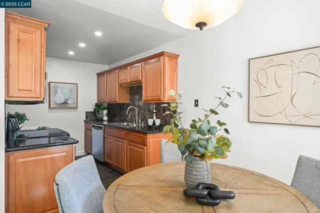 a living room with furniture potted plant and a large mirror