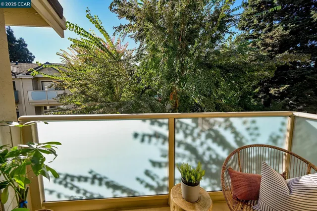 a living room with furniture a rug and a table