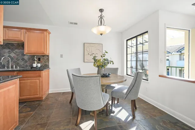 a kitchen that has a sink and a stove