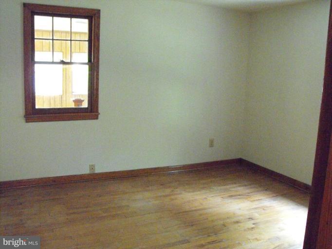 116 Paw Paw Road North Bloomery, WV 26817 - Photo 8 of 16 an empty room with a window
