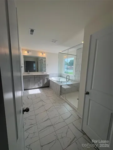 a bathroom with a sink and mirror