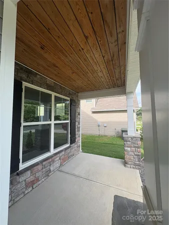 a view of house with backyard