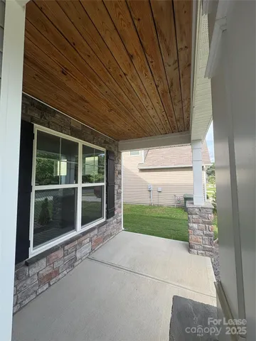 a view of house with backyard