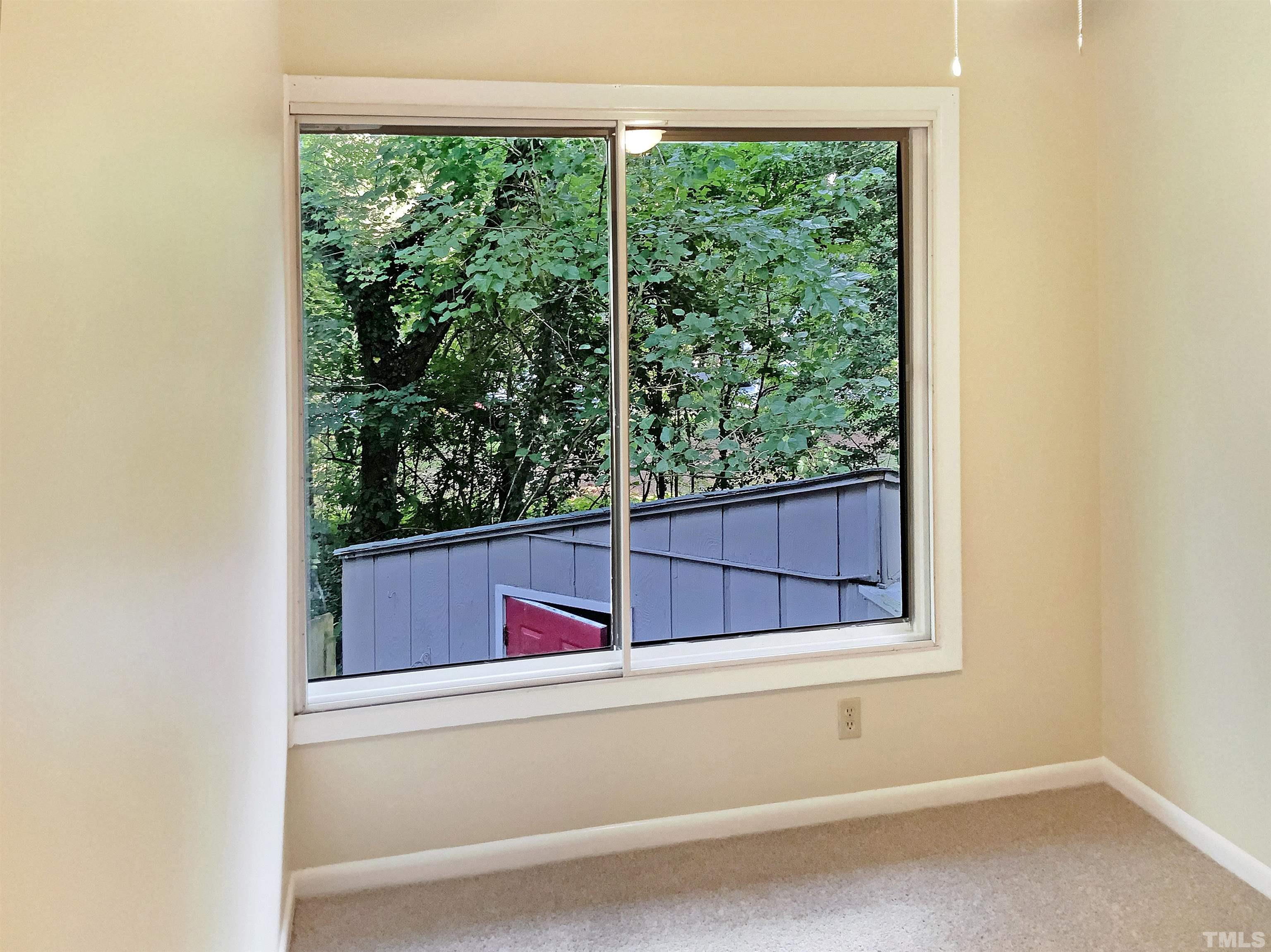 1710 Quail Ridge Road Raleigh, NC 27609 - Photo 10 of 16 a view of a living room with a bed and a window