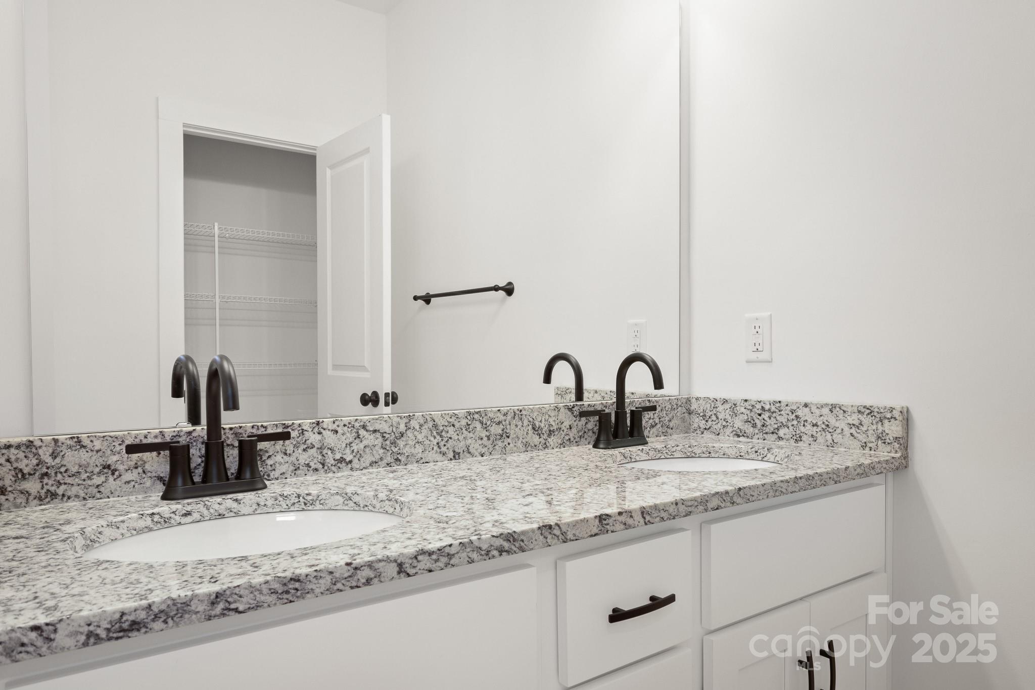 6155 Long Branch Road Salisbury, NC 28147 - Photo 23 of 35 a bathroom with a granite countertop sink and a mirror