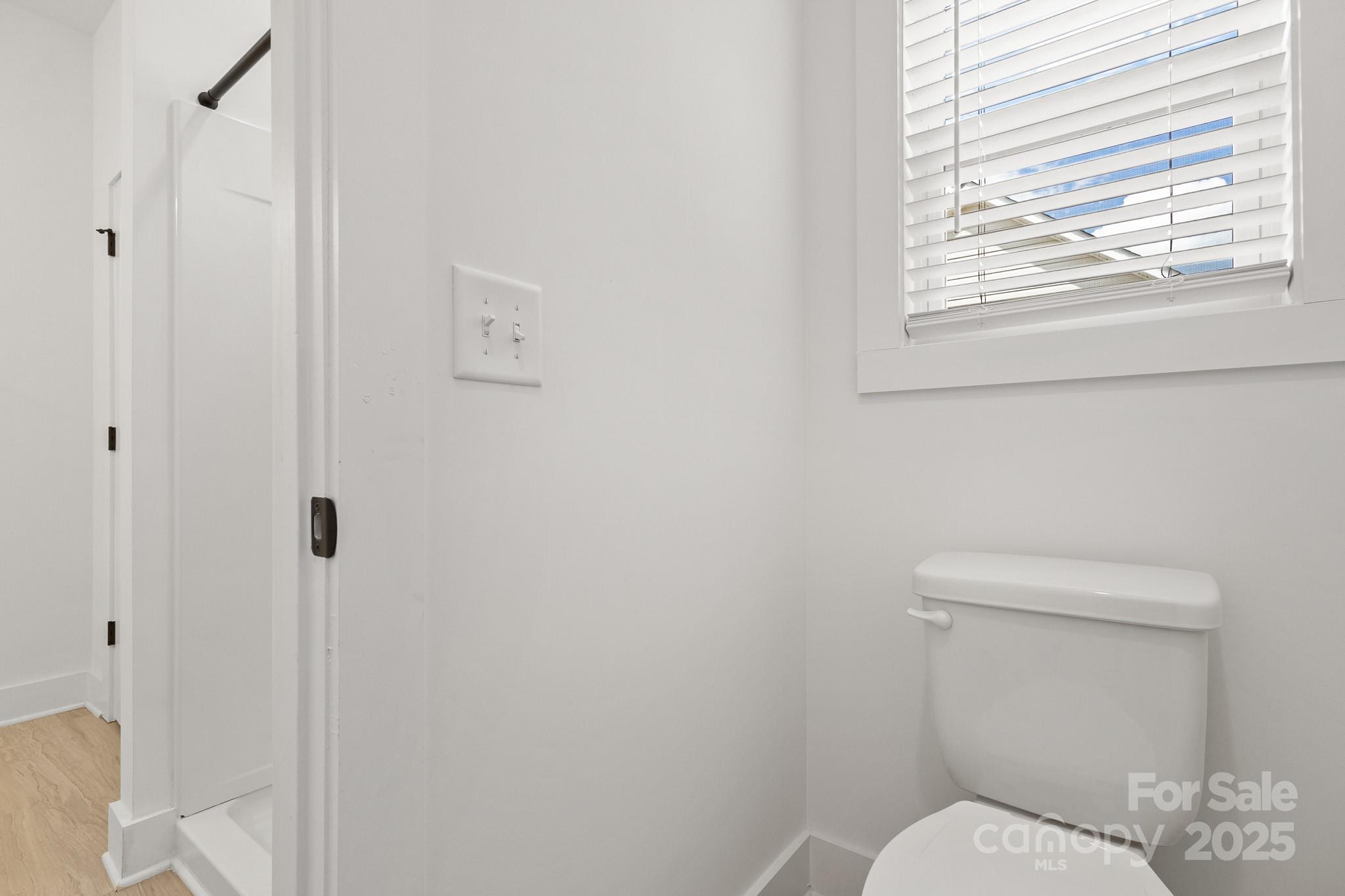 6155 Long Branch Road Salisbury, NC 28147 - Photo 25 of 35 a white toilet sitting next to a window