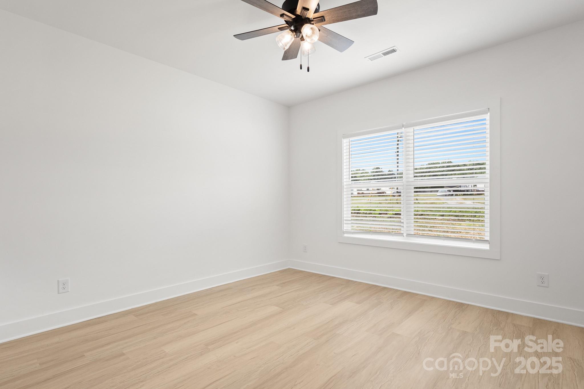 6155 Long Branch Road Salisbury, NC 28147 - Photo 28 of 35 an empty room with a window and a fan