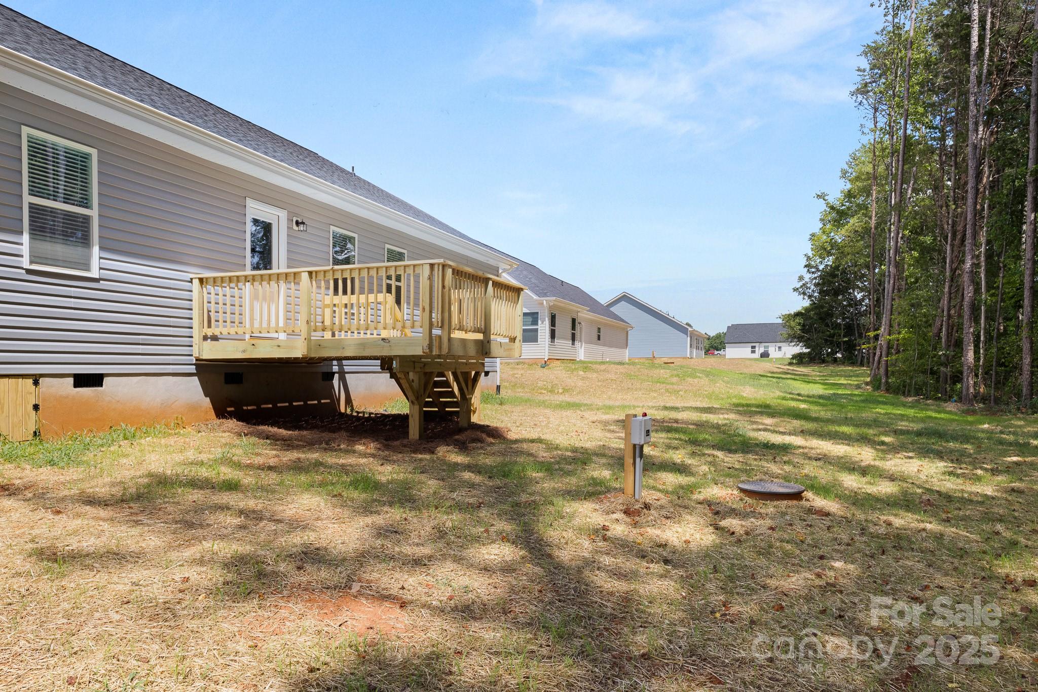 6155 Long Branch Road Salisbury, NC 28147 - Photo 33 of 35 a view of house with backyard and trees in the background