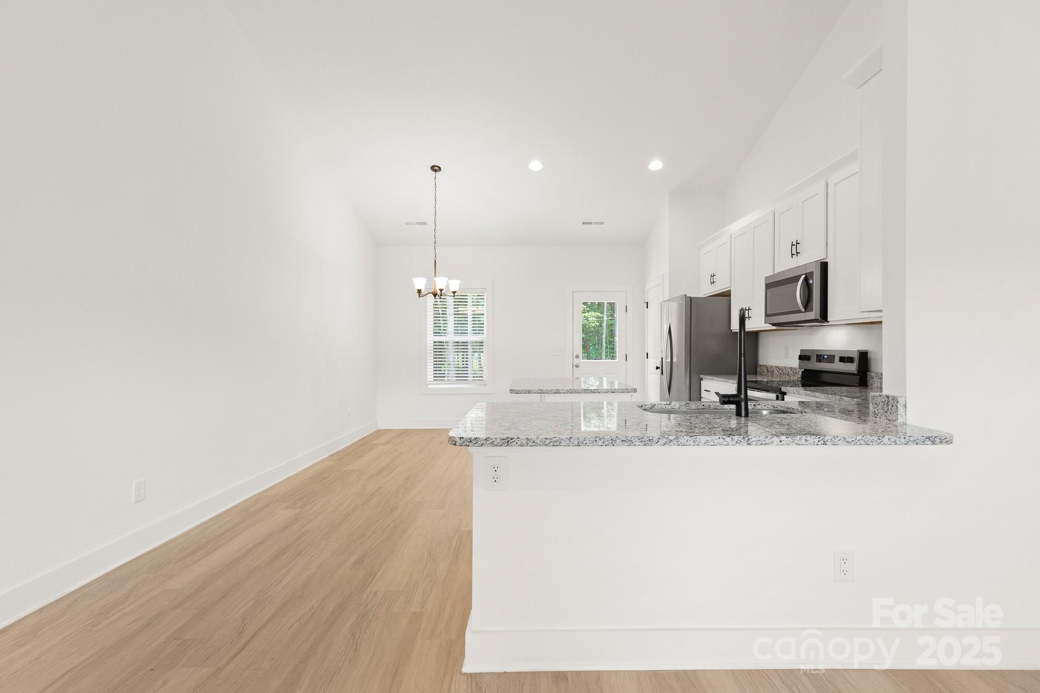 6155 Long Branch Road Salisbury, NC 28147 - Photo 9 of 35 a view of a kitchen with a sink and a window