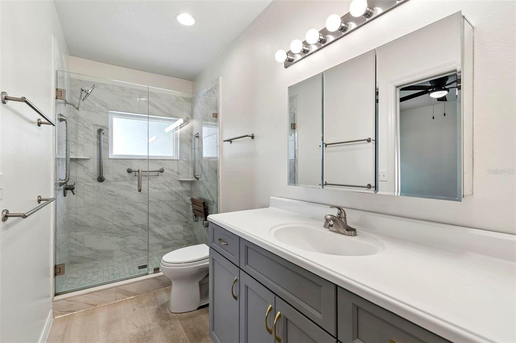 5311 Watson Road Riverview, FL 33578 - Photo 18 of 33 a bathroom with a sink a toilet and shower