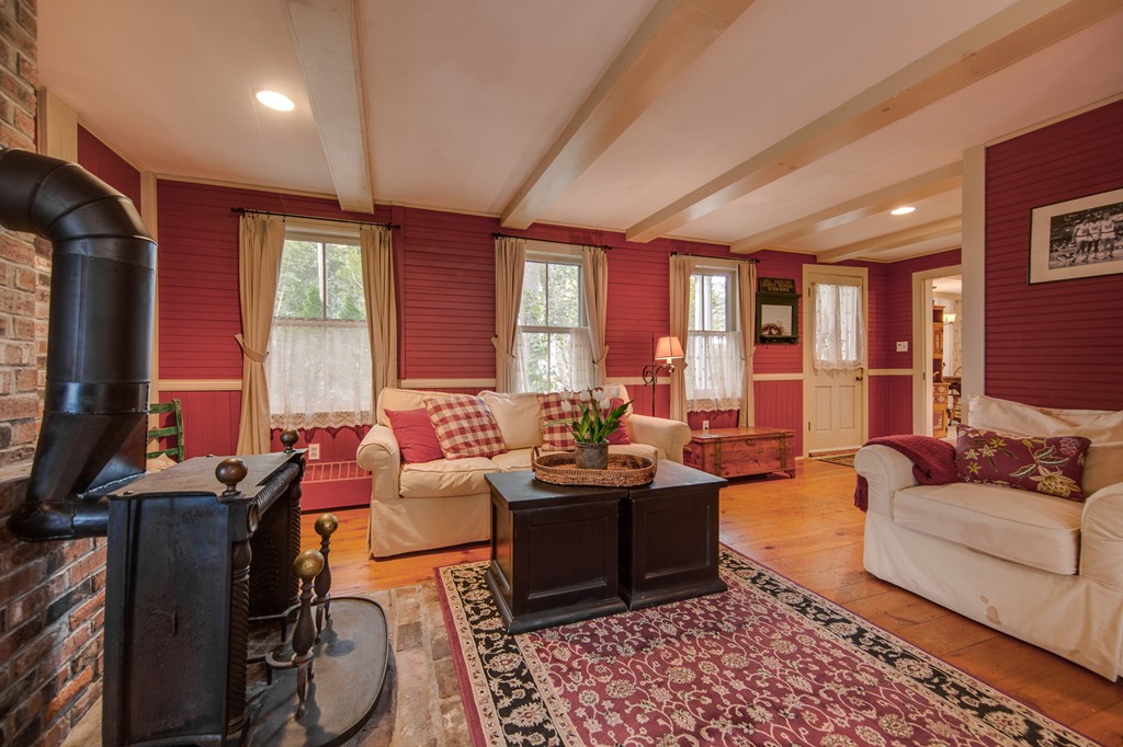 6 Oak Street Grafton, MA 01519 - Photo 16 of 27 a living room with furniture and a flat screen tv