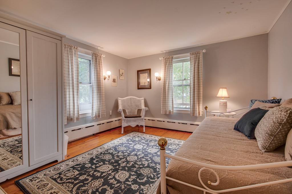 6 Oak Street Grafton, MA 01519 - Photo 20 of 27 a bedroom with a bed and wooden floor