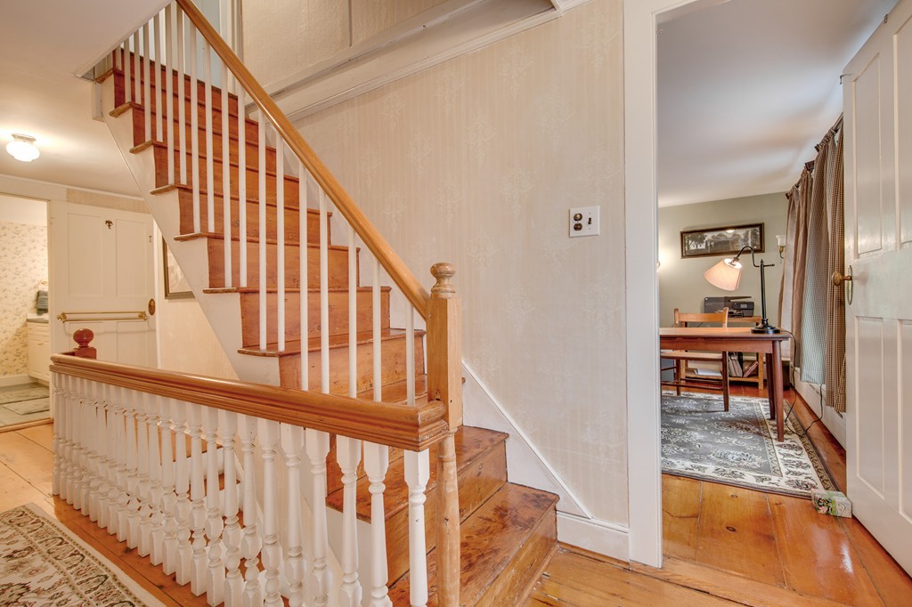 6 Oak Street Grafton, MA 01519 - Photo 23 of 27 a view of entryway with wooden floor and a front door