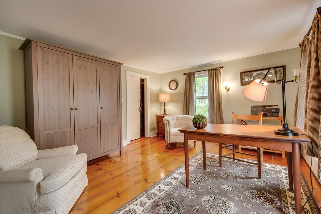 6 Oak Street Grafton, MA 01519 - Photo 24 of 27 a living room with furniture a large window and a table