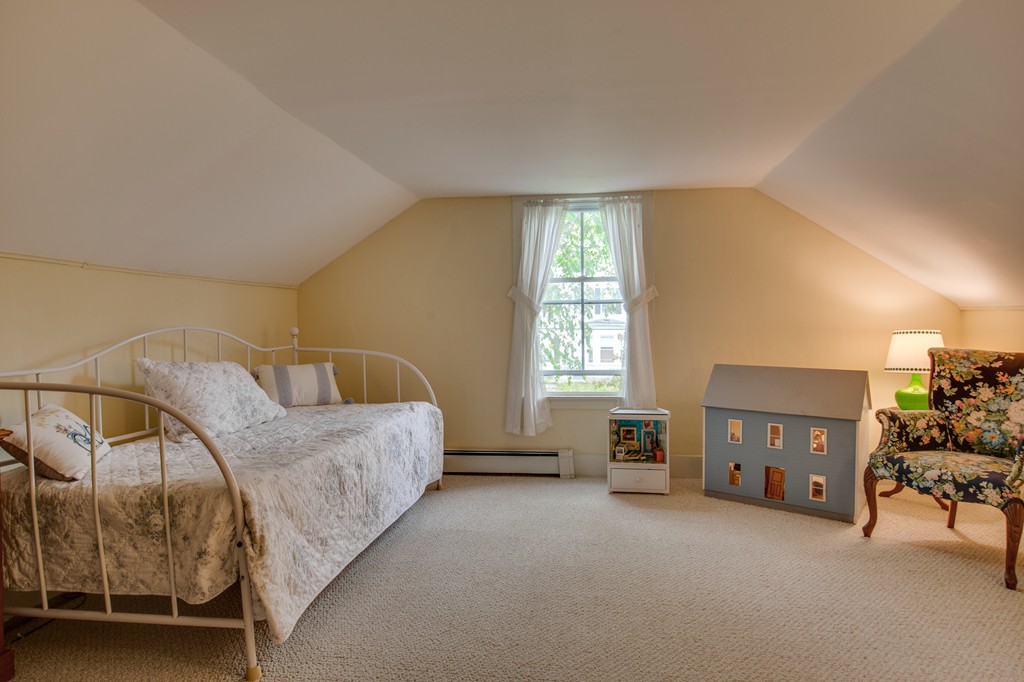 6 Oak Street Grafton, MA 01519 - Photo 25 of 27 a living room with furniture and a window