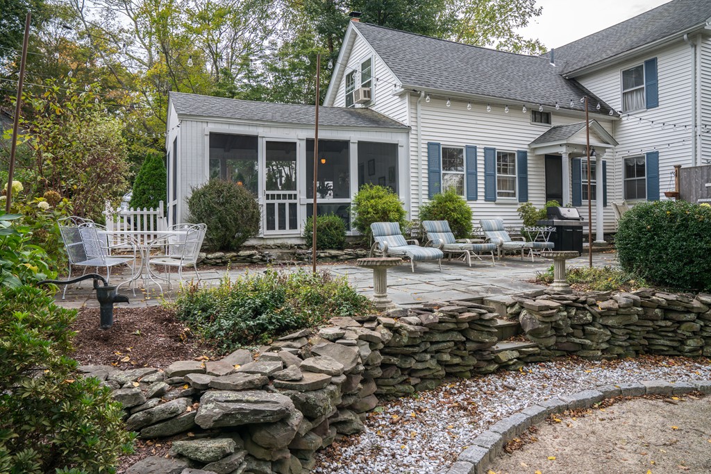 6 Oak Street Grafton, MA 01519 - Photo 5 of 27 a front view of house with yard and trees around