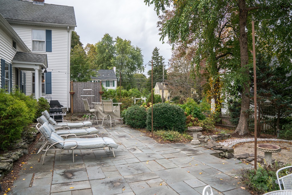 6 Oak Street Grafton, MA 01519 - Photo 6 of 27 a view of a patio with table and chairs and potted plants