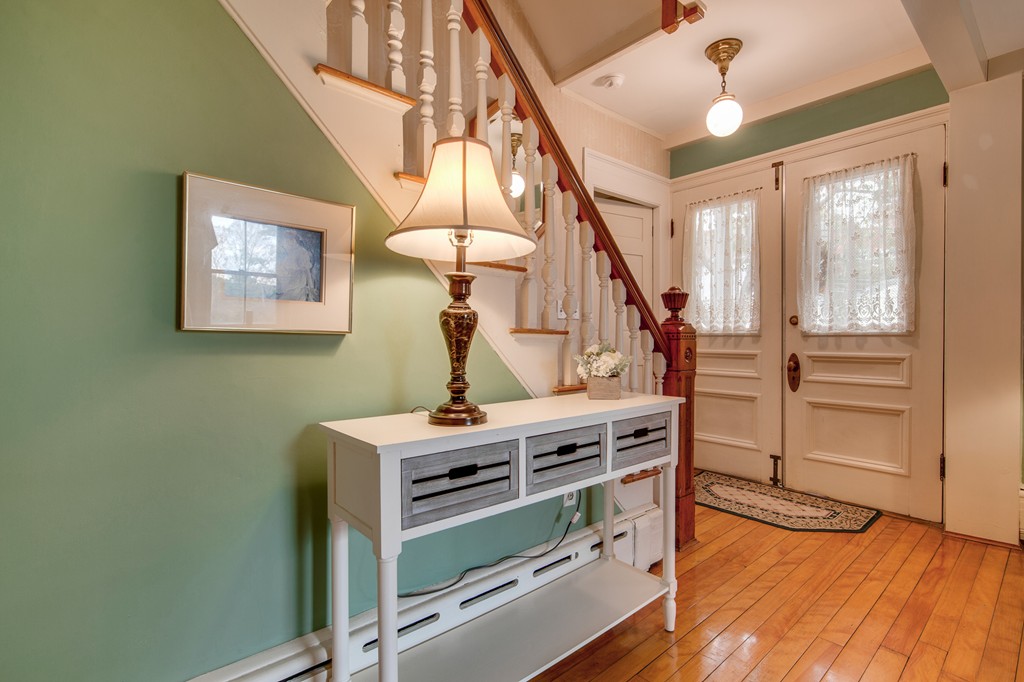 6 Oak Street Grafton, MA 01519 - Photo 7 of 27 a view of hallway with stairs and wooden floor