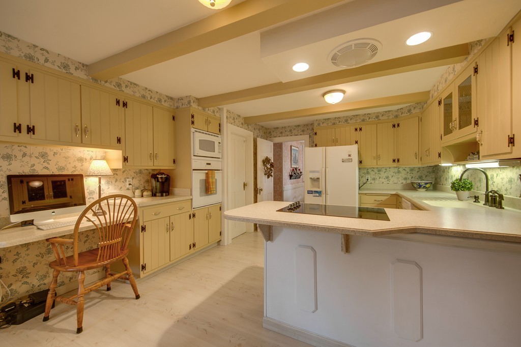 6 Oak Street Grafton, MA 01519 - Photo 10 of 27 a kitchen with sink cabinets and window