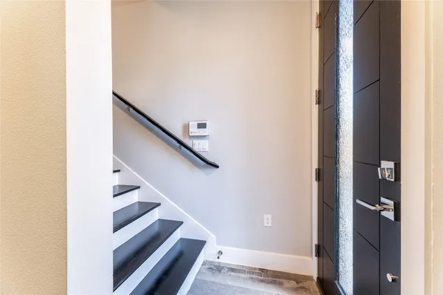 a view of a hallway with staircase