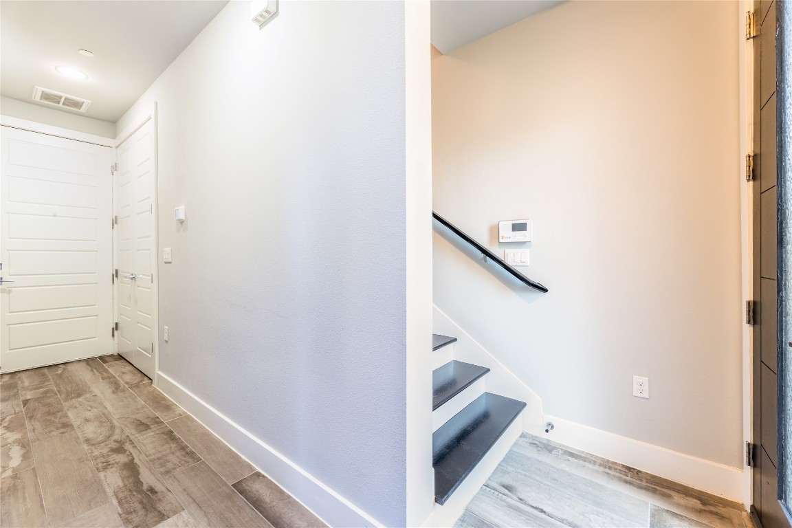 1417 Kramer Lane, Unit 9 Austin, TX 78758 - Photo 14 of 40 a view of a hallway with staircase