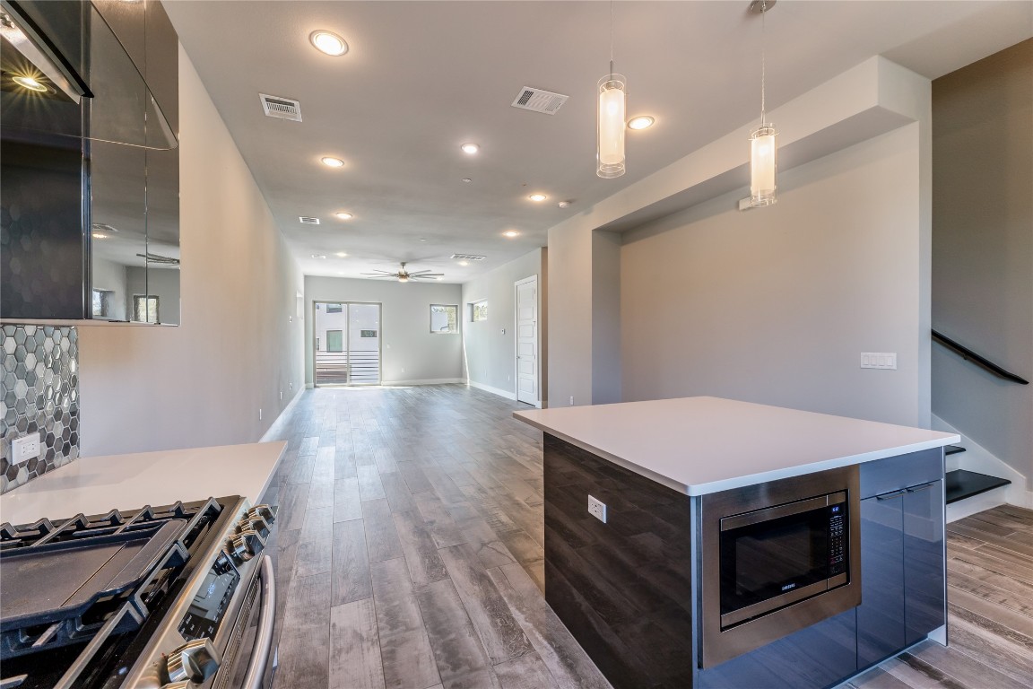 1417 Kramer Lane, Unit 9 Austin, TX 78758 - Photo 21 of 40 a kitchen with a stove and a refrigerator