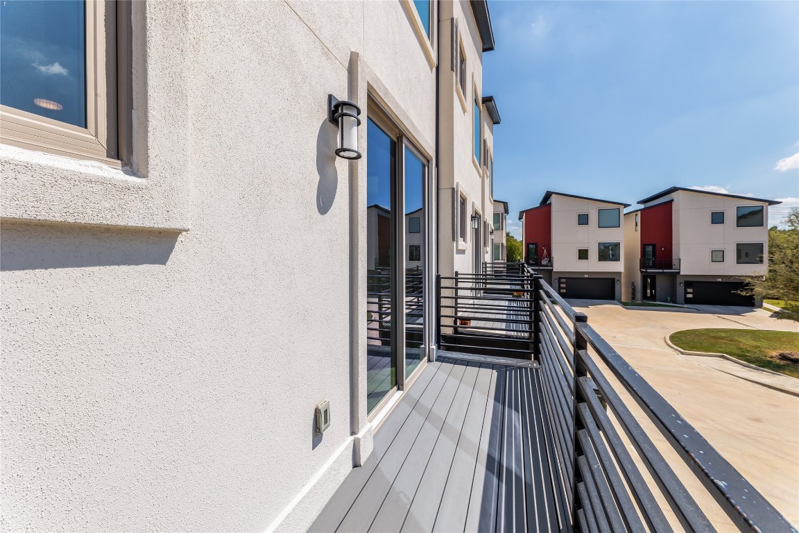1417 Kramer Lane, Unit 9 Austin, TX 78758 - Photo 25 of 40 a view of a balcony with stainless steel appliances wooden floor and a window