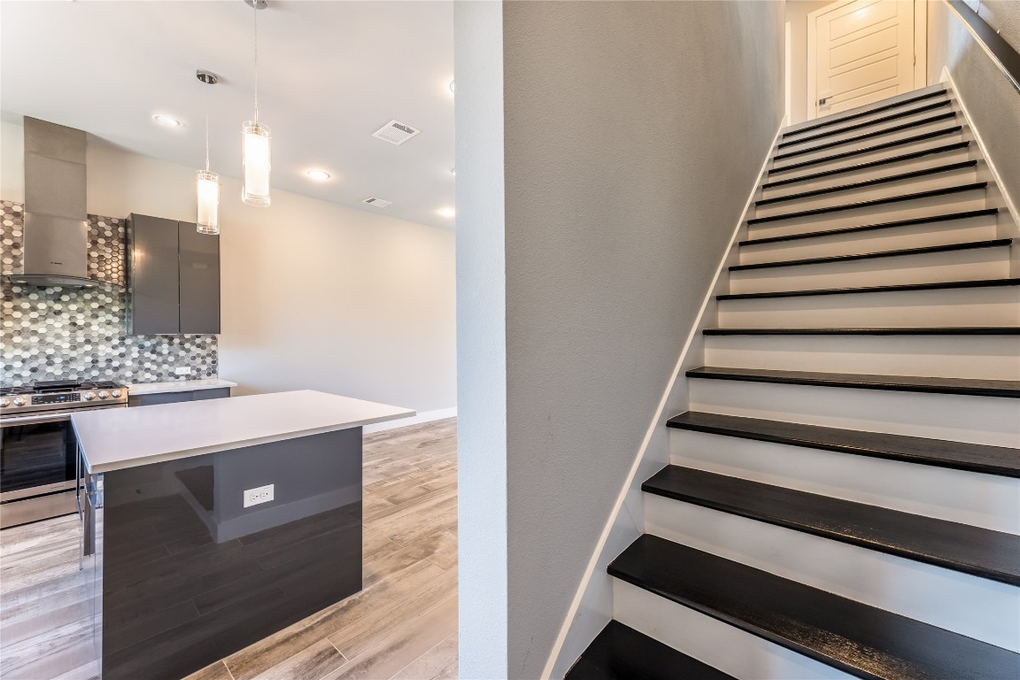 1417 Kramer Lane, Unit 9 Austin, TX 78758 - Photo 27 of 40 a view of entryway and hall with wooden floor
