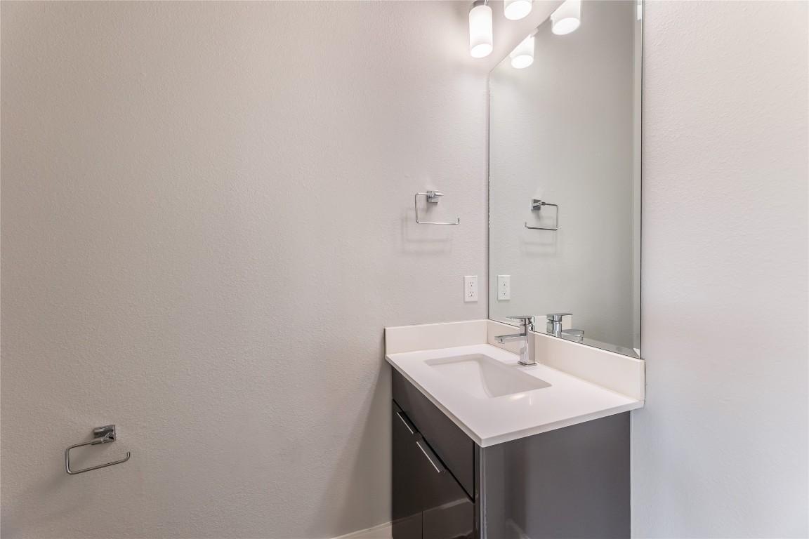 1417 Kramer Lane, Unit 9 Austin, TX 78758 - Photo 28 of 40 a bathroom with a sink and a mirror