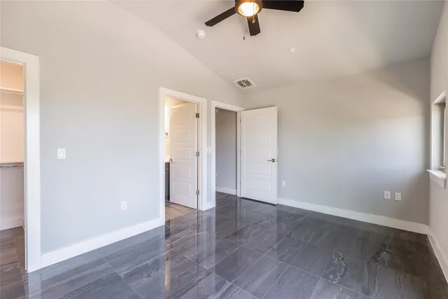 a bathroom with a shower and a sink
