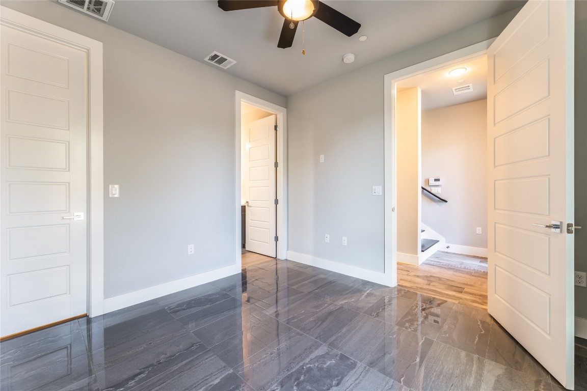 1417 Kramer Lane, Unit 9 Austin, TX 78758 - Photo 7 of 40 wooden floor in an empty room with a window