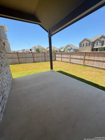 a view of a swimming pool with an outdoor seating
