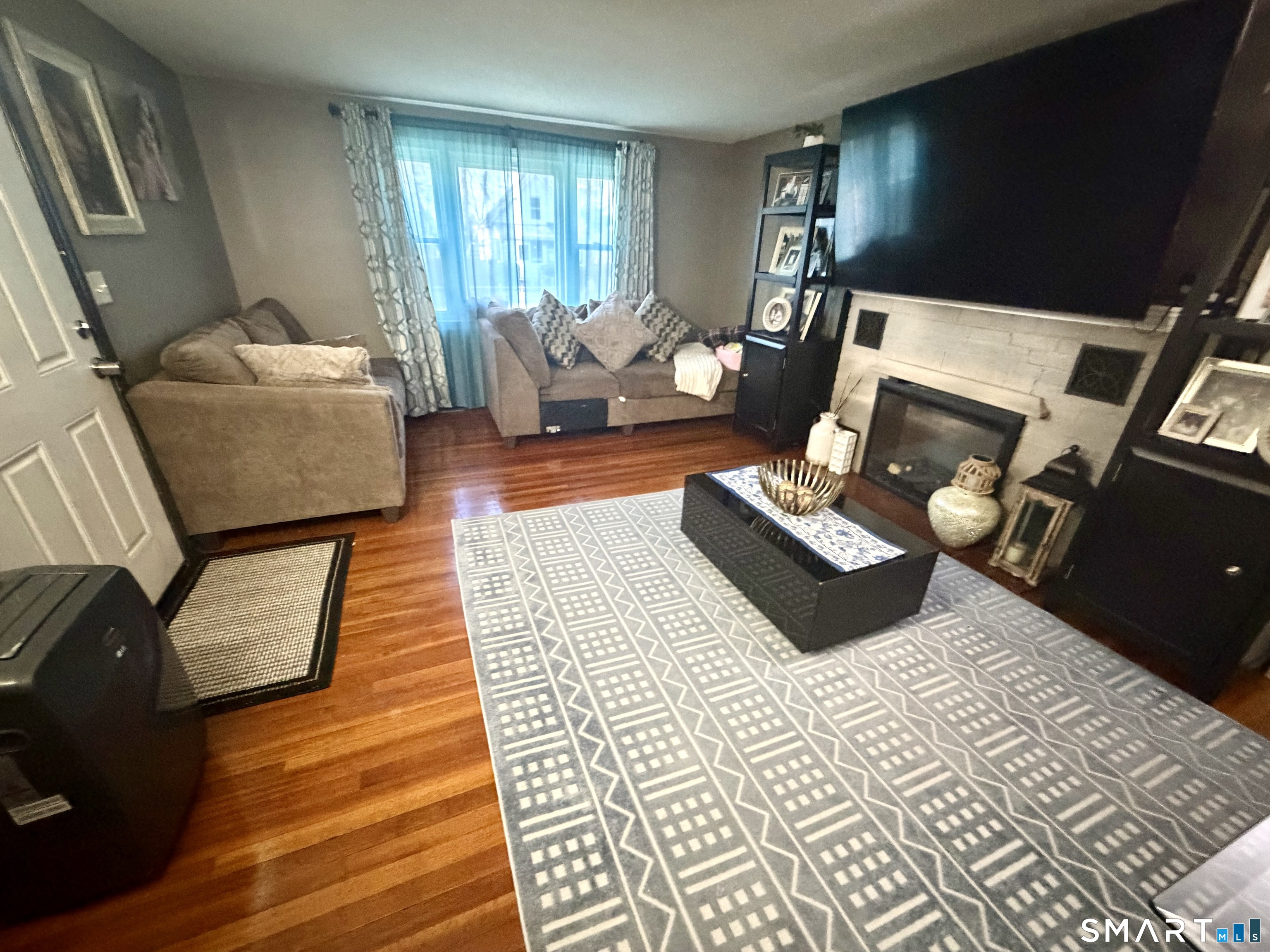 75 Elizabeth Avenue Bloomfield, CT 06002 - Photo 3 of 17 a bedroom with furniture and wooden floor