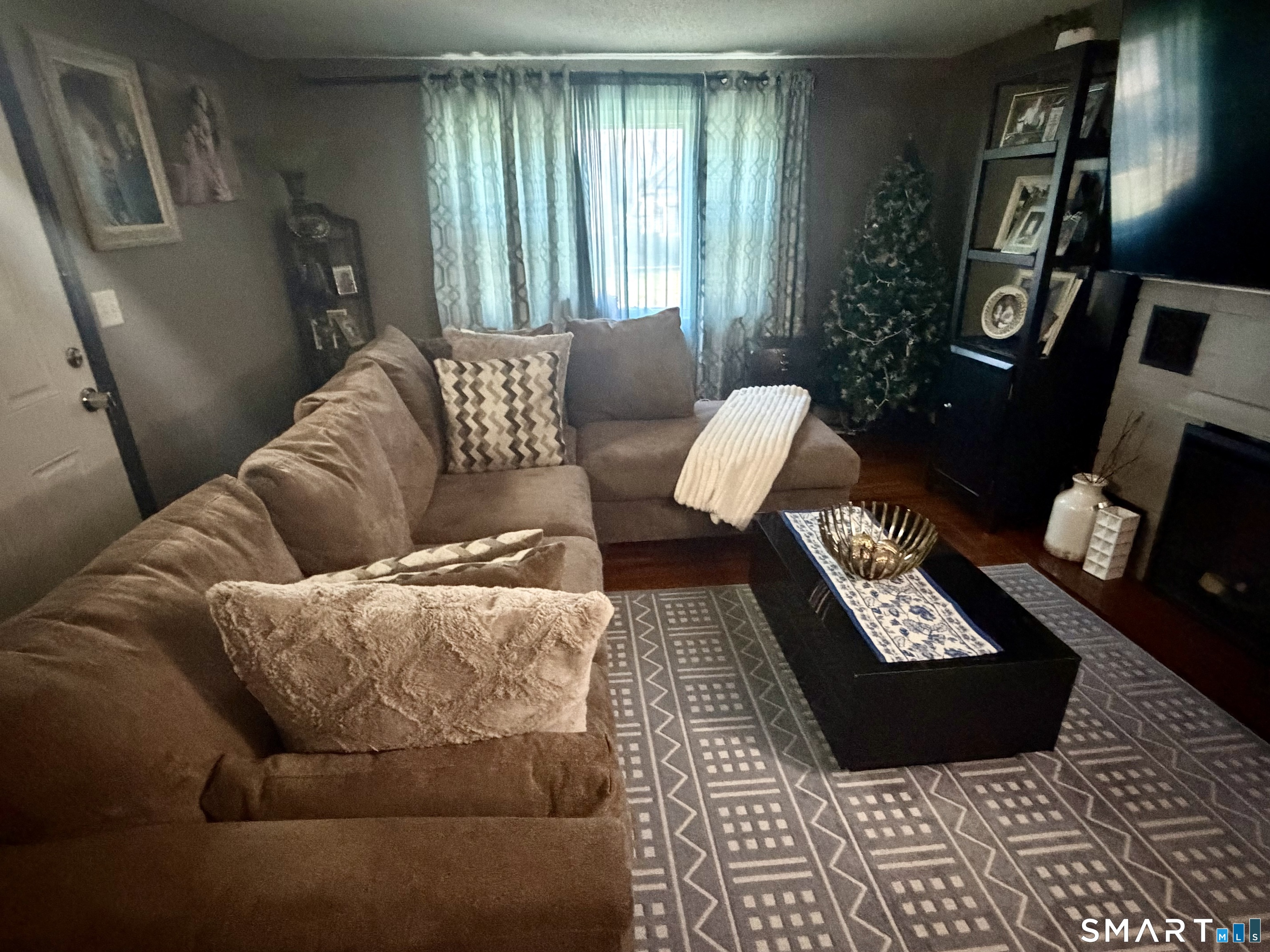 75 Elizabeth Avenue Bloomfield, CT 06002 - Photo 5 of 17 a living room with furniture and a window