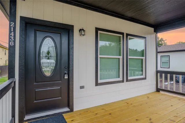 a front view of a house with a large window