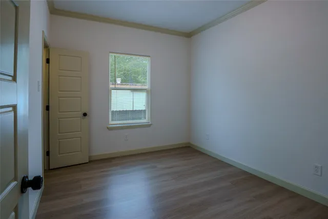 wooden floor and window in an empty room