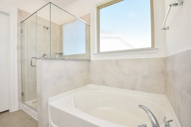 a bath tub sitting next to a window