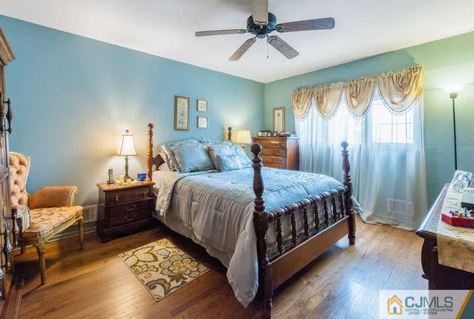 9 Hansen Road Old Bridge, NJ 08857 - Photo 22 of 28 a spacious bedroom with a bed and wooden floor