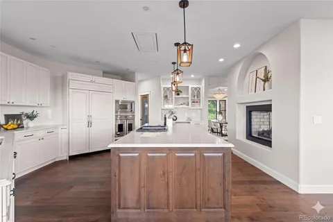 a kitchen with a white cabinets stove and refrigerator