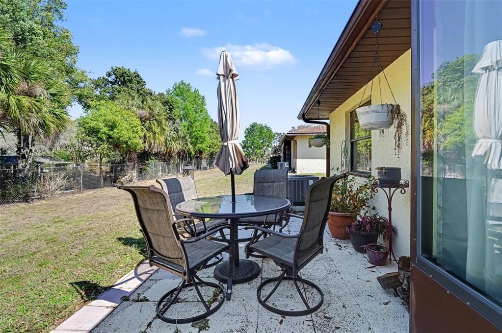 12435 Orangewood Circle Tavares, FL 32778 - Photo 26 of 30 a view of an outdoor seating area