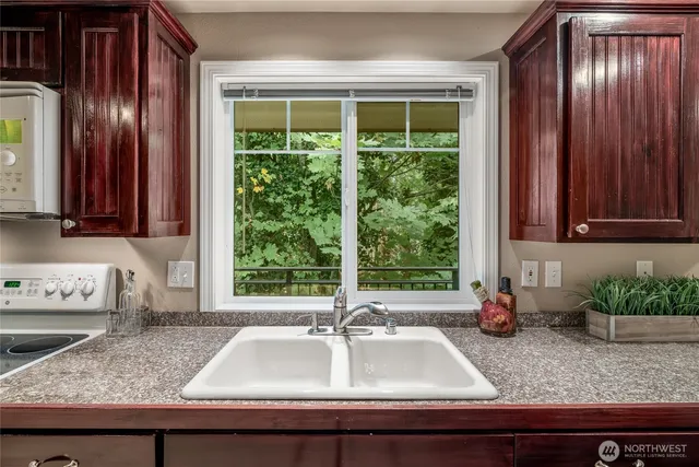 a kitchen with a sink and a window