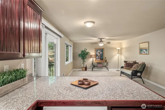 a living room with furniture and a rug