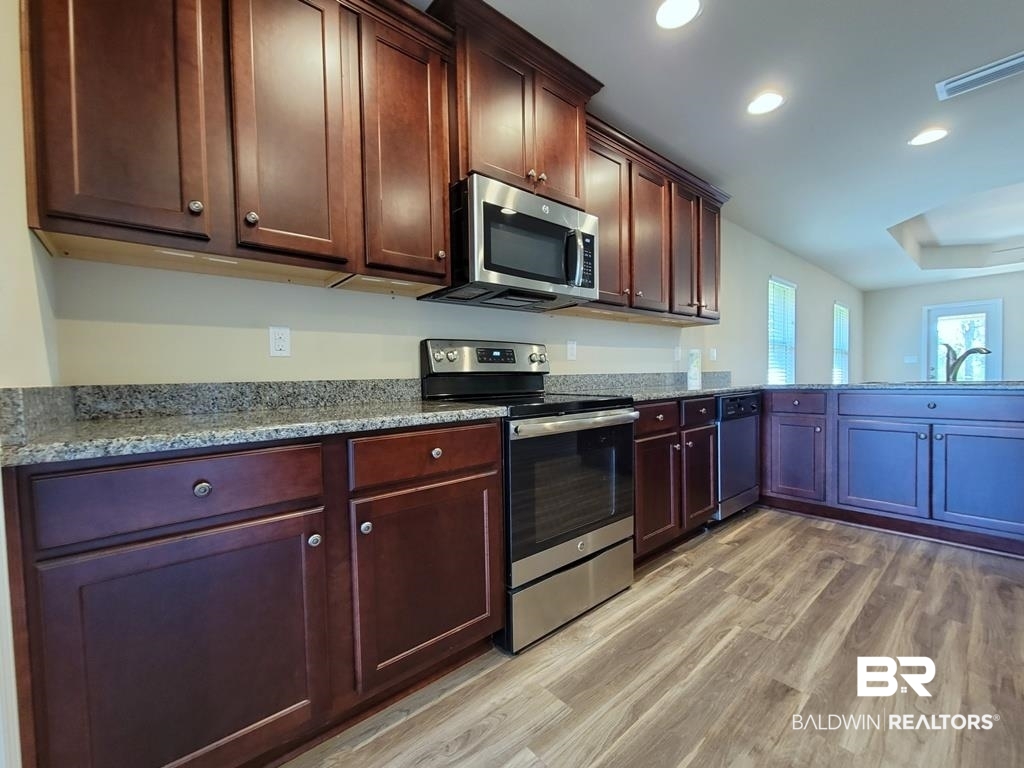 22465 Respite Lane Foley, AL 36535 - Photo 5 of 33 Kitchen from Dining Room