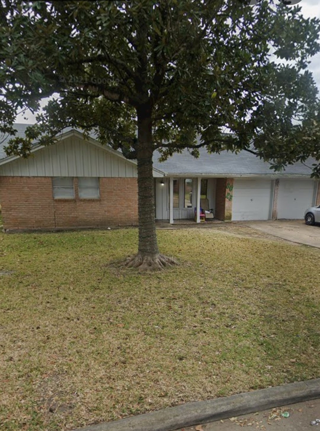 8623 Nairn Street Houston, TX 77074 - Photo 6 of 7 a front view of a house with a garden