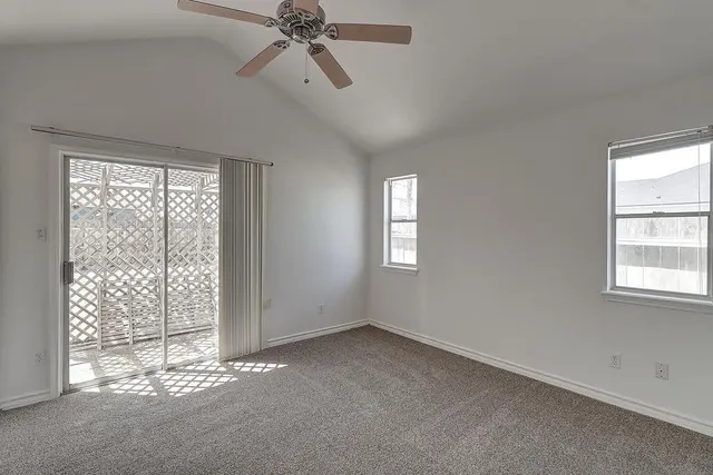 a view of empty room with windows