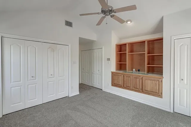 a bathroom with a shower and a glass door