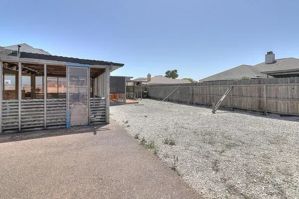 a view of roof with wooden fence
