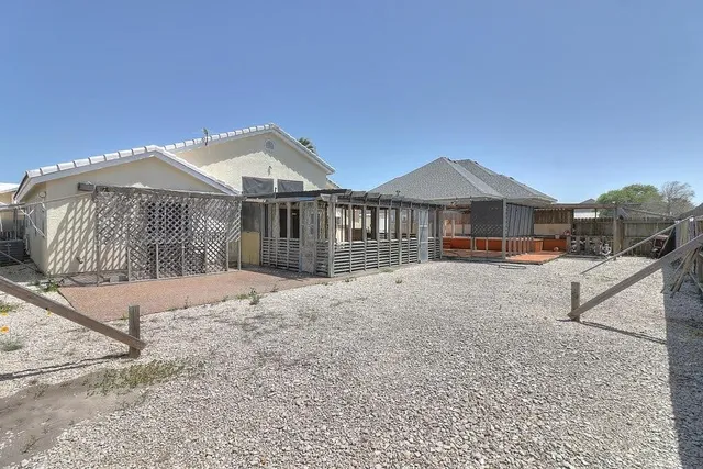 a patio outdoor space with patio furniture and wooden floor
