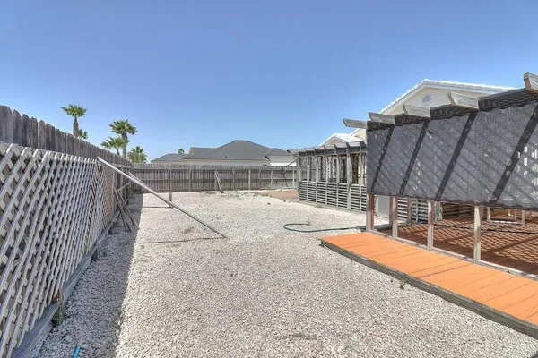 a view of a chairs and table in a patio