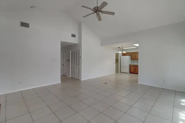 a kitchen with cabinets stainless steel appliances and window